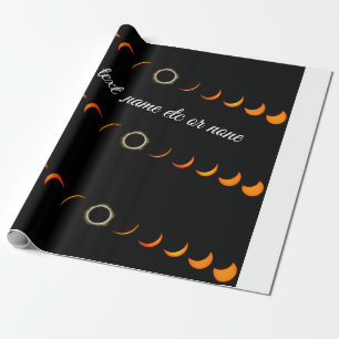 De Presente papel embrulhado em eclipse solar laranja preto