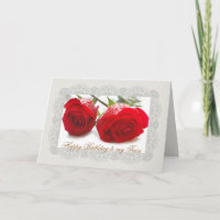 Duas rosas vermelhas juntam o cartão de