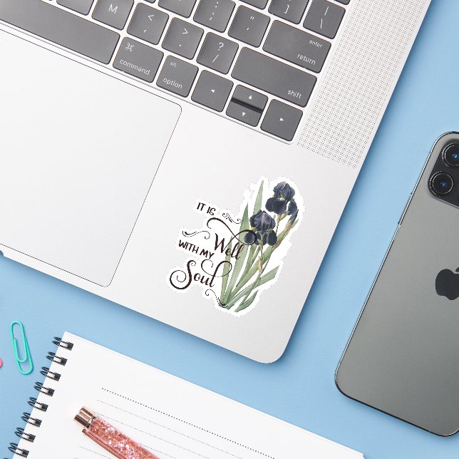 É um adesivo de íris roxa bem feito (Notebook com iPhone)