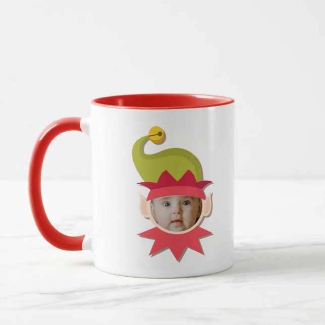 Elf Engraçado Enfrentando A Caneca De Natal (Esquerda)