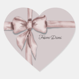 Embalado num adesivo cor-de-rosa com etiqueta arco