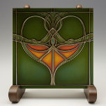 Emerald Grace Art Nouveau<br><div class="desc">Infusamos sua casa com a elegância eterno do "Azulejo cerâmico Emerald Grace Art Nouveau", uma peça impressionante que incorpora a fluidez e a beleza orgânica do movimento Art Nouveau. Esse azulejo cerâmico, impresso por Zazzle, apresenta um design captivador com linhas fluidas e um motivo central em tons ricos de laranja...</div>