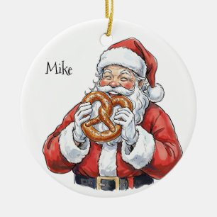 Enfeite de cerâmica do Papai Noel comendo pretzel
