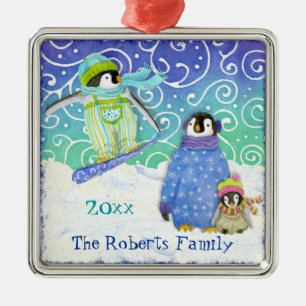 Enfeites de natal da família do pinguim do esqui