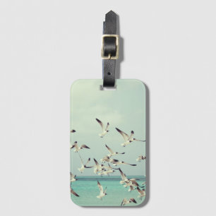 Etiqueta De Bagagem Bando de gaivotas voando acima do oceano