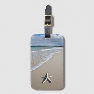 Etiqueta De Bagagem Estrela do mar em uma praia remota
