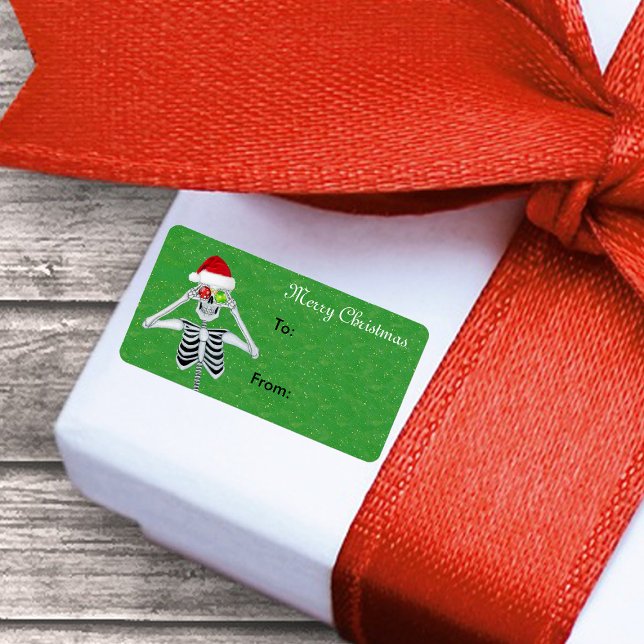 Etiqueta Feliz Natal Esqueleto Olhos Verdes (Christmas skeleton ornament eyes Santa hat on green gift tag sticker label.)