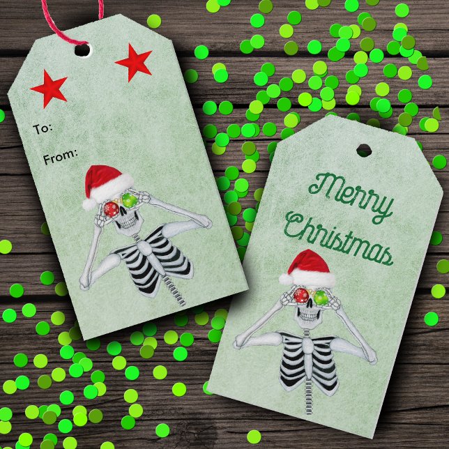 Etiqueta Para Presente Engraçado Esqueleto Olhos Vermelhos Estrelas Verme (Silly Skeleton ornament eyes Santa Hat red stars on green hanging Christmas gift tags.)