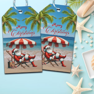 Etiqueta Para Presente Natal com Papai Noel sob um Guarda-Chuva de Praia
