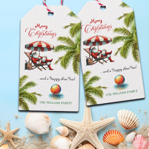 Etiqueta Para Presente Natal com Papai Noel sob um Guarda-Chuva de Praia