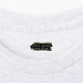 Etiquetas Traço de pintura preta e roupas geométricas Dourad