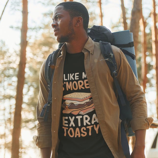 Eu Gosto Da Minha Camisa De T-Shirt Muito Torrada (Man at a camp site wearing "I Like My S'Mores Extra Toasty" t-shirt.)
