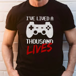 Eu vivi mil vidas jogador de vídeo<br><div class="desc">Mostre seu amor por jogos com a camiseta "Eu vivi mil vidas jogador de vídeo". Esta camisa apresenta um design ousado com uma controladora de jogos e uma declaração impressionante, perfeita para qualquer jogador ávido. Feito com materiais de alta qualidade, essa camiseta garante conforto e durabilidade para longas sessões de...</div>