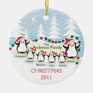 Família bonito dos pinguins dos enfeites de natal