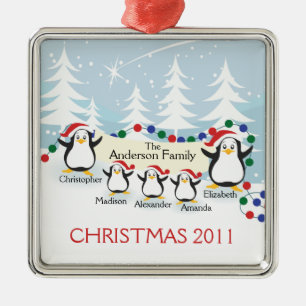 Família bonito dos pinguins dos enfeites de natal
