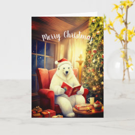 Feliz Urso de Natal Lendo num Cartão de Cadeira