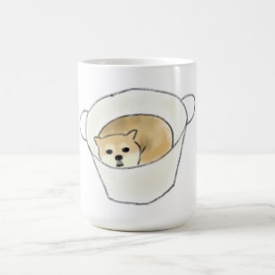 Filhote de Shiba Inu Descansando em Xícara Branca