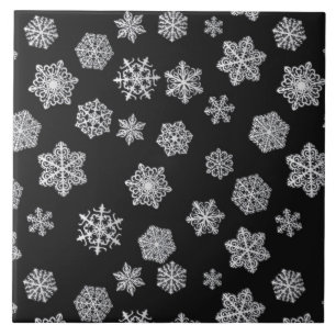 Flocos de neve de prata sobre fundo preto