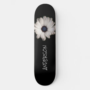Flor de margarida branca preta de skate