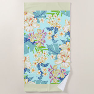 Floral tropical com uma toalha de praia verde