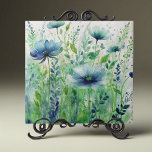 Flores Azuis e Folhagem Verde de Aquarela<br><div class="desc">Apresentando nosso belo azulejo decorativo de cerâmica. Esta peça impressionante apresenta um design de aquarela cativante que traz a beleza da natureza para a sua casa. A trabalho de arte apresenta uma cena de jardim exuberante com delicadas flores azuis e folhagem verde-verde, criando uma atmosfera serena e tranquila. Cada flor...</div>