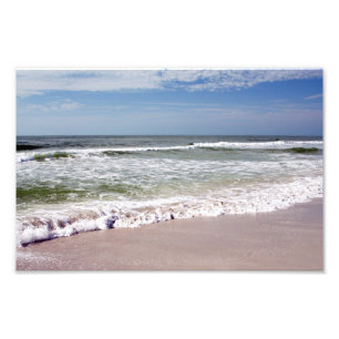 Foto Ondas oceânicas na praia rosa-arenosa