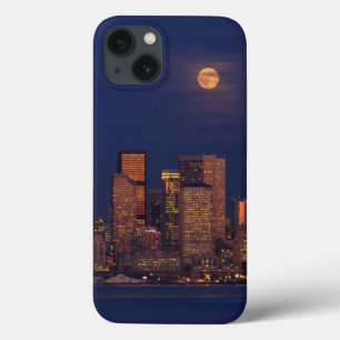 Full moon rising over downtown Seattle skyline