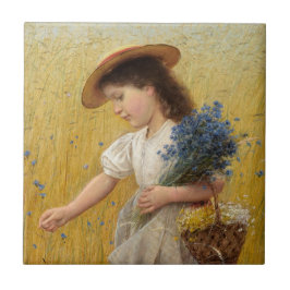 Garota jovem em um campo de trigo