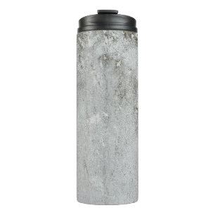 Garrafa Térmica Cinza branca envelhecida na parede do alcatrão