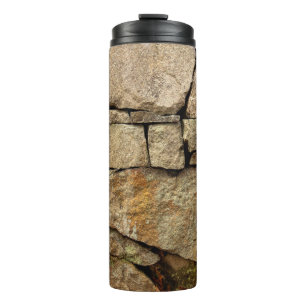 Garrafa Térmica Um muro de pedra feito de paralelepípedos textu de
