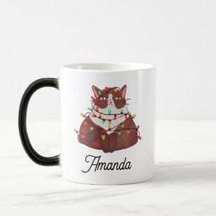 Gato bonito com caneca mágica leve de natal