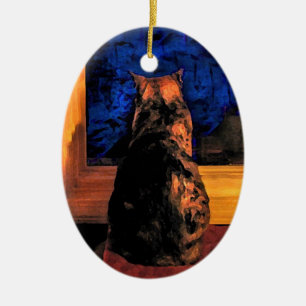 Gato em enfeites de natal da janela
