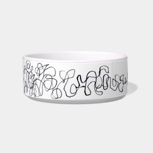 Gato na tigela de comida de lã