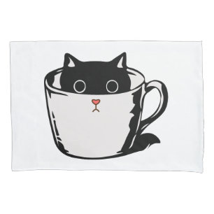 Gato preto com nariz vermelho escondido em um copo