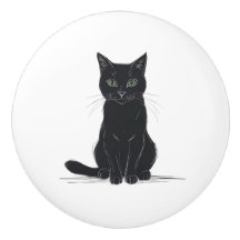 Gato preto em puxador de porta de fundo branco