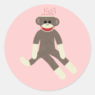 Golpeie a menina do macaco com uma etiqueta