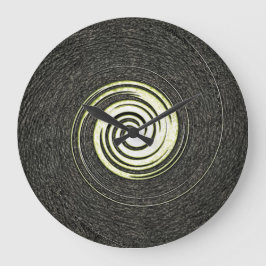 Grande relógio abstrato preto e dourado na parede