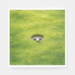 Guardanapo De Papel Bola de golfe está ao lado do buraco no green
