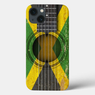 Guitarra acústica velha com bandeira jamaicana
