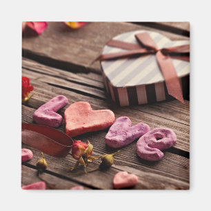 Imã Amor da palavra com o presente dado forma coraçã