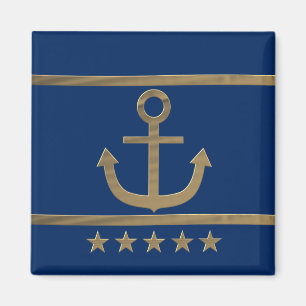 Imã âncora dourada sobre fundo azul marinho