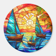 Barcos à vela ao pôr do sol