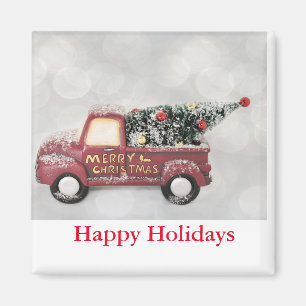 Imã caminhão vintage vermelho em um fundo bokeh cinza