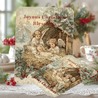 Ímã Christmas card with baby Jesus in a manger and ang