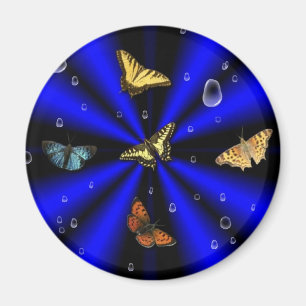 Imã Colírio e borboleta a preto e azul