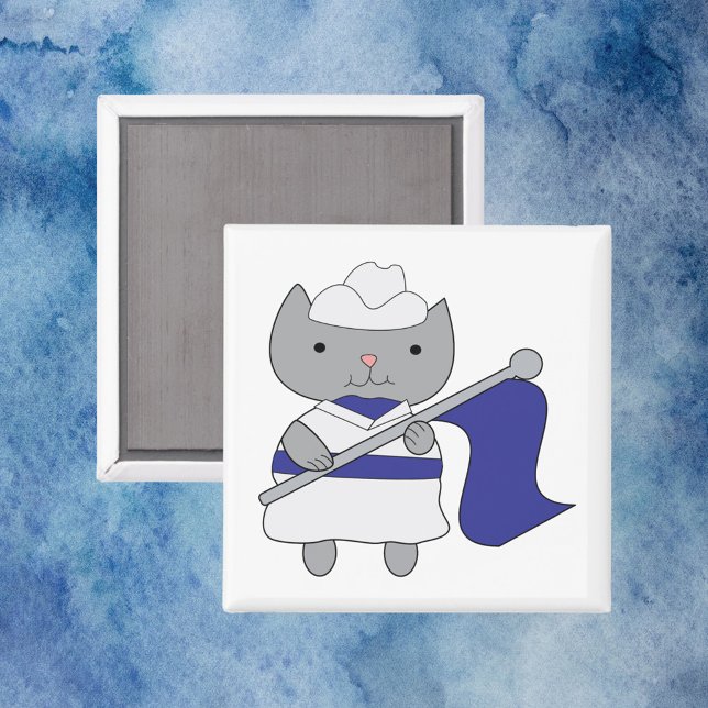 Imã Cor do Gato - Guarda Azul Branco (A magnet with a gray kitty cat wearing a blue and white color guard uniform.)