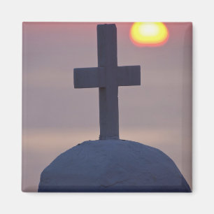 Imã Cruz no topo da igreja ao pôr do sol, Mykonos,