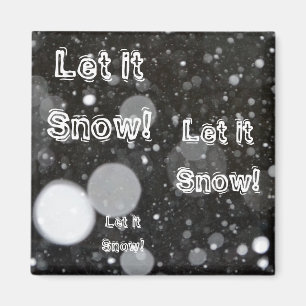 Imã Deixe nevar em um fundo de neve