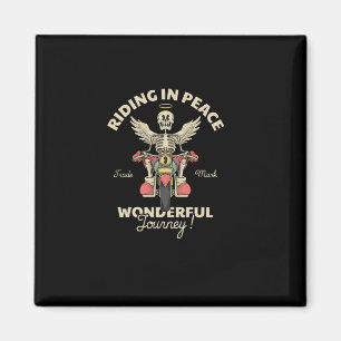 Imã desenho animado emblema de um anjo crânio numa mot