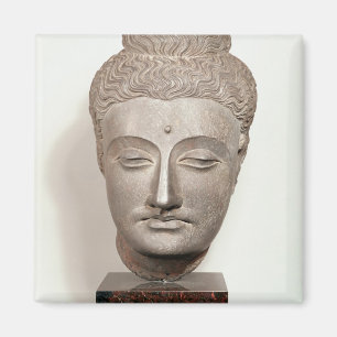 Imã Dirija de uma estátua do Buddha, de